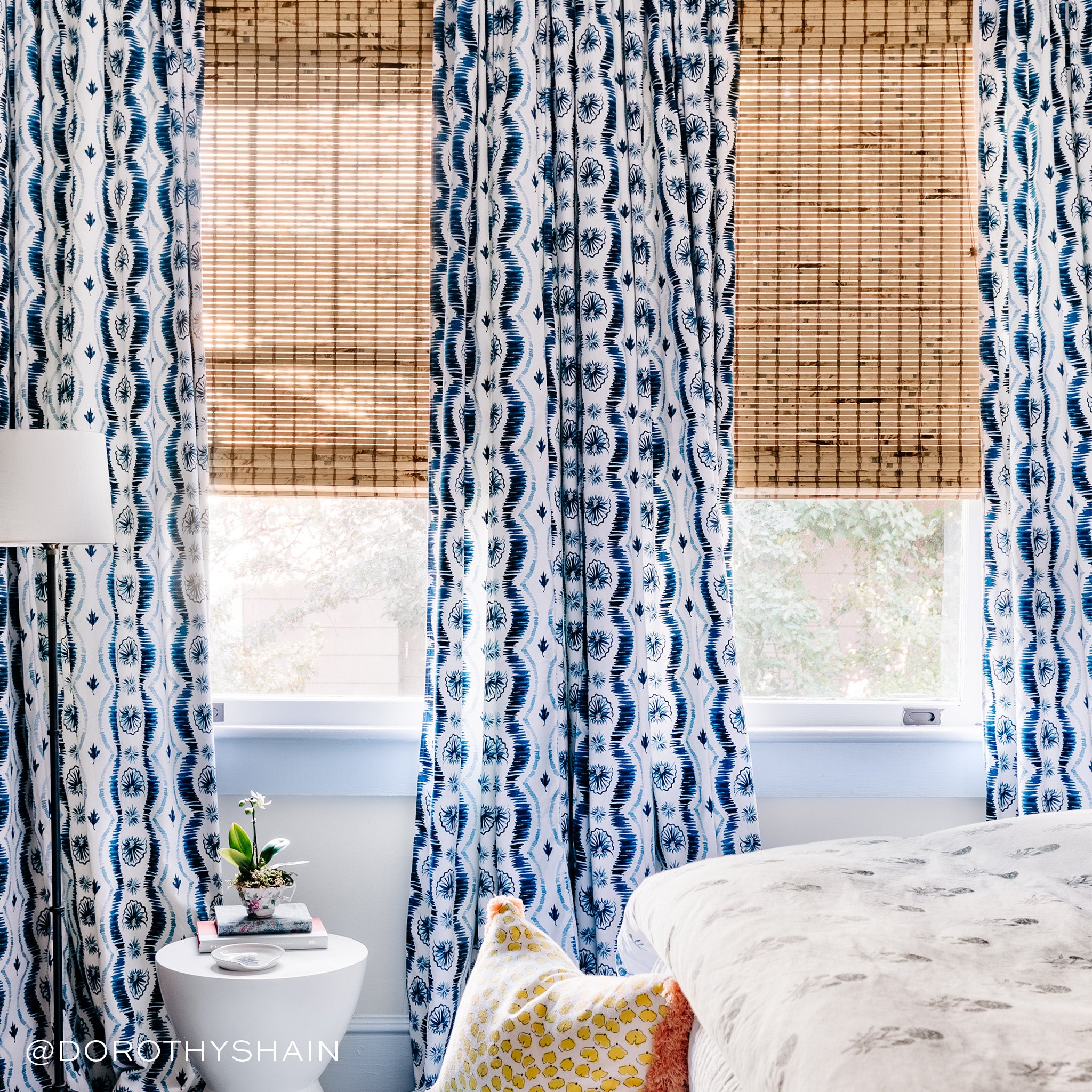Alice curtains in blue patterned fabric paired with woven natural shades, custom made-to-order with fast turnaround in the USA