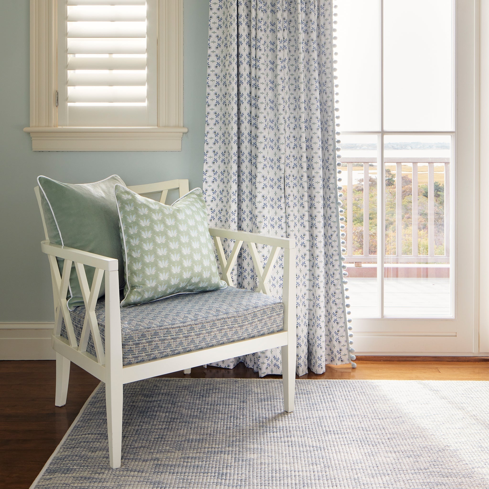Lee fabric pillows and chair cushion in soft greens and blue floral curtains, made-to-order in the USA with short lead times