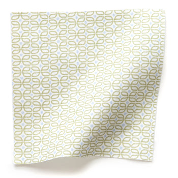 Loomi Moss fabric with delicate green geometric pattern on white cotton, made-to-order in the USA with short lead times