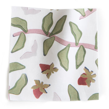 Nellie Curtain (sold per panel) fabric swatch with green leaves and soft pink accents, made-to-order in the USA with fast lead times