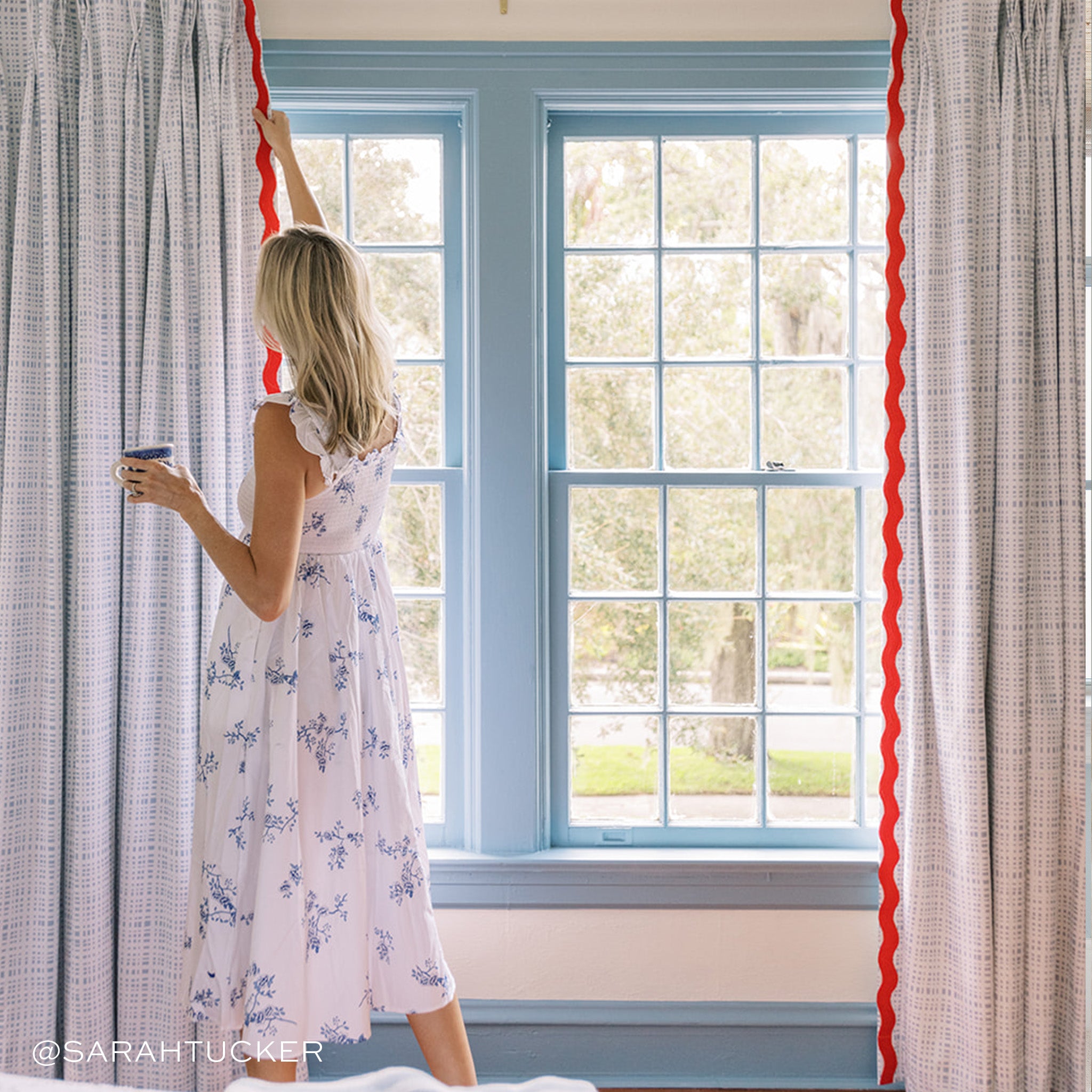 Ginger fabric curtains with a subtle grid and bold red trim, made-to-order in the USA with fast turnaround and quality craftsmanship