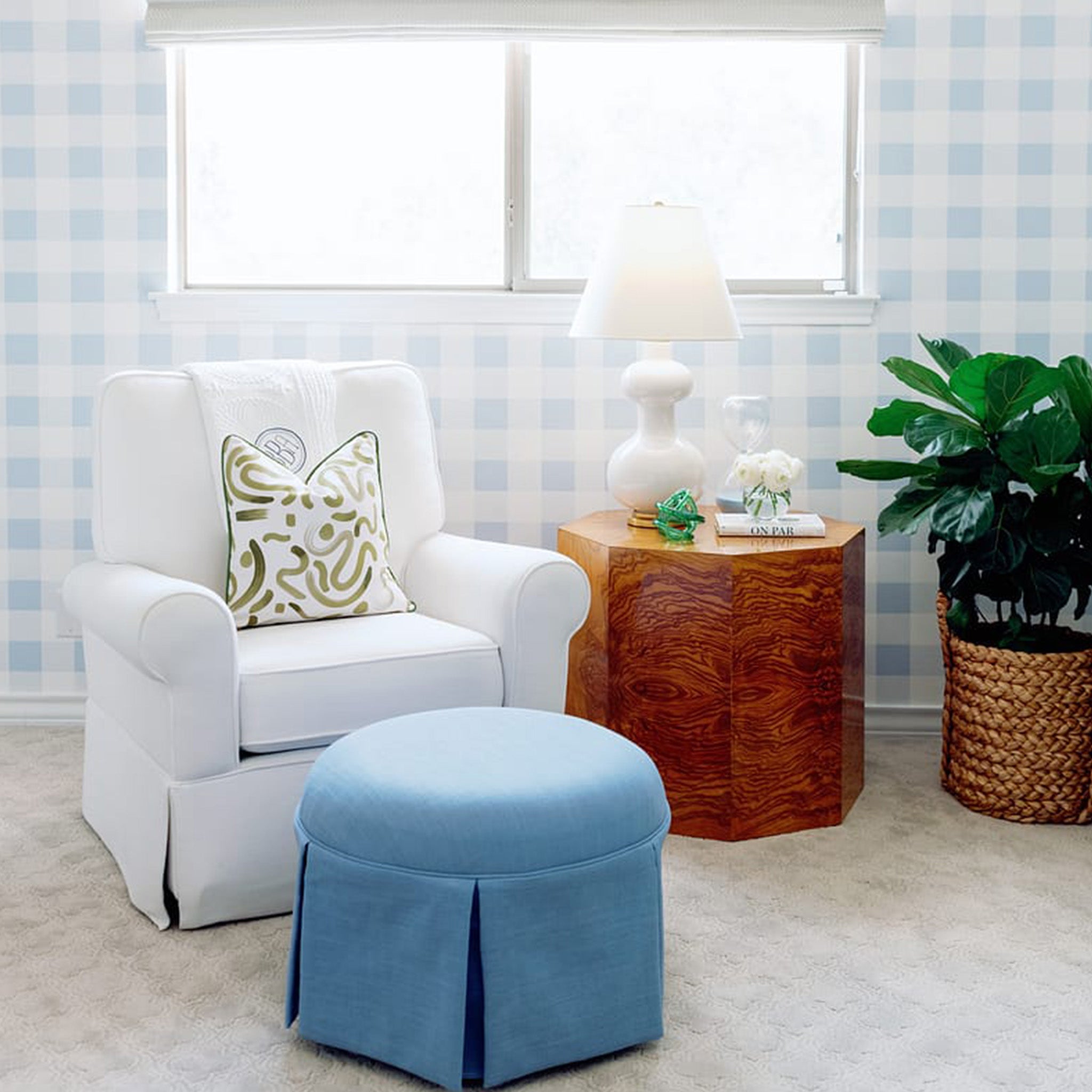 Hockney Moss pillow with abstract green pattern on white chair in bright room, made-to-order in the USA with fast delivery