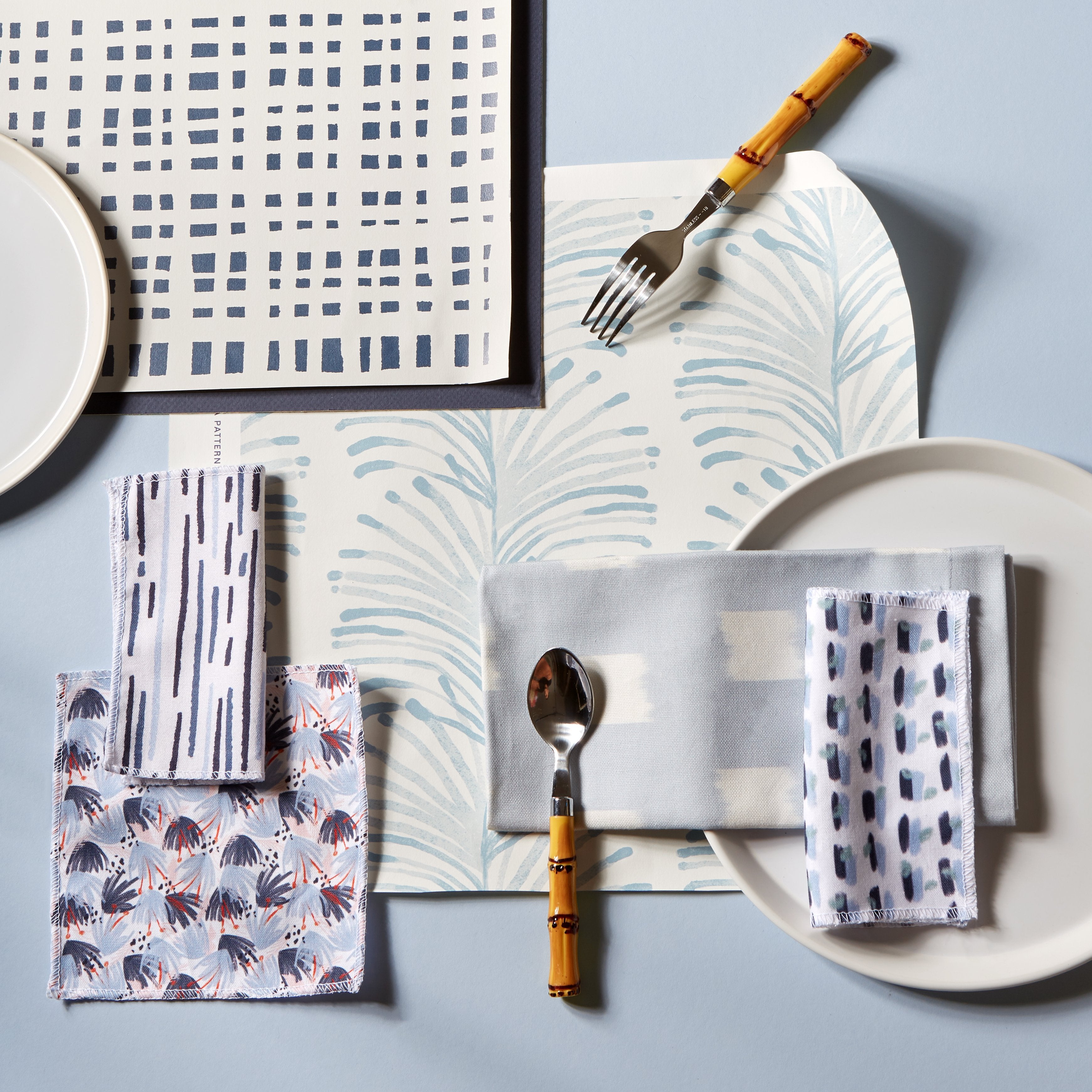 Poppy fabric swatches and napkins with blue and gray patterns, made-to-order in the USA with short lead times and quality material