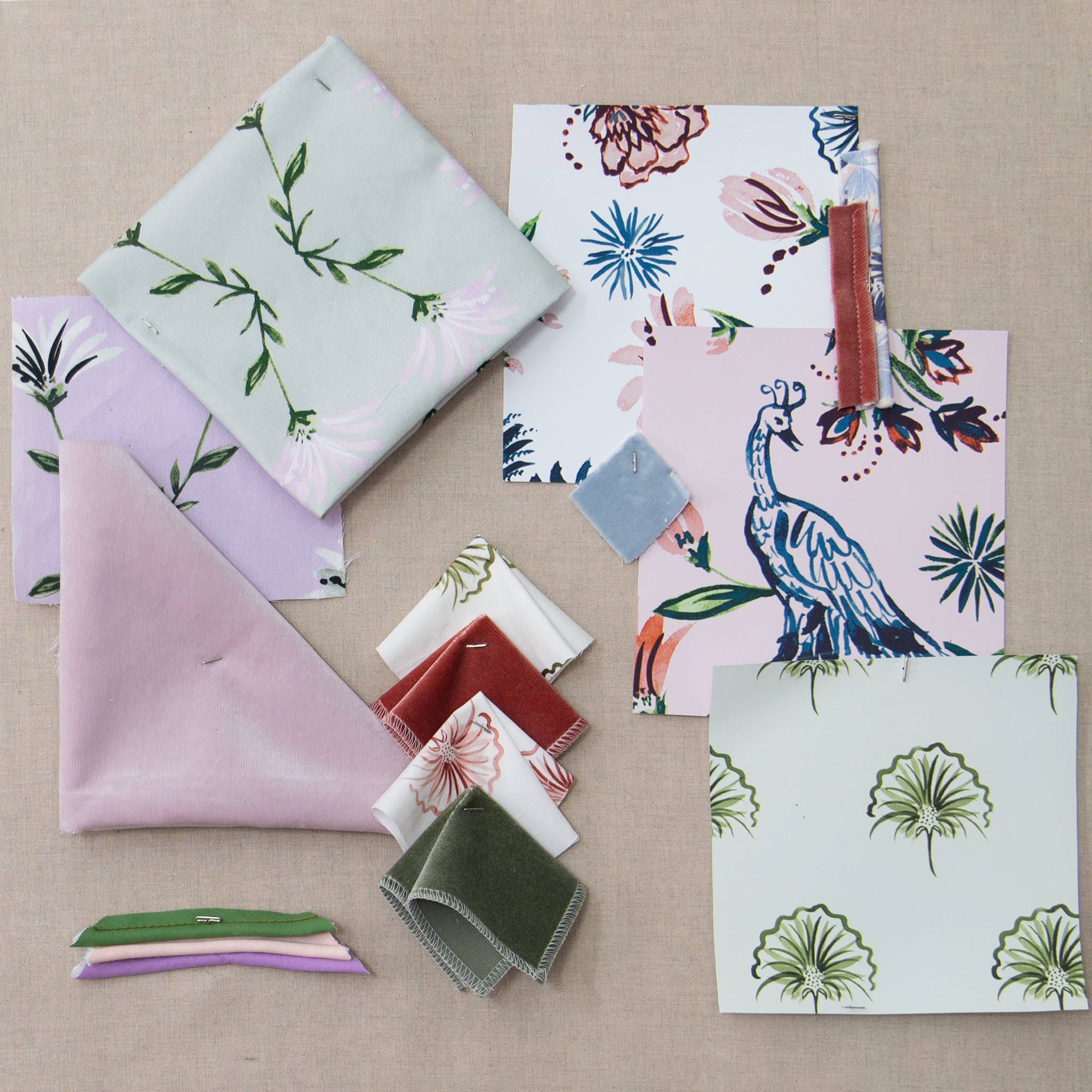 Lilac made-to-order fabric samples with floral and bird patterns in soft purples and greens, manufactured in the USA with quick lead times