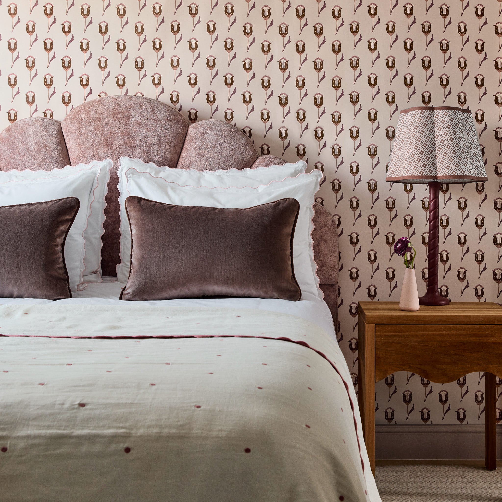 Walnut made-to-order bed with textured pink velvet headboard and matching pillows, crafted in the USA with fast turnaround