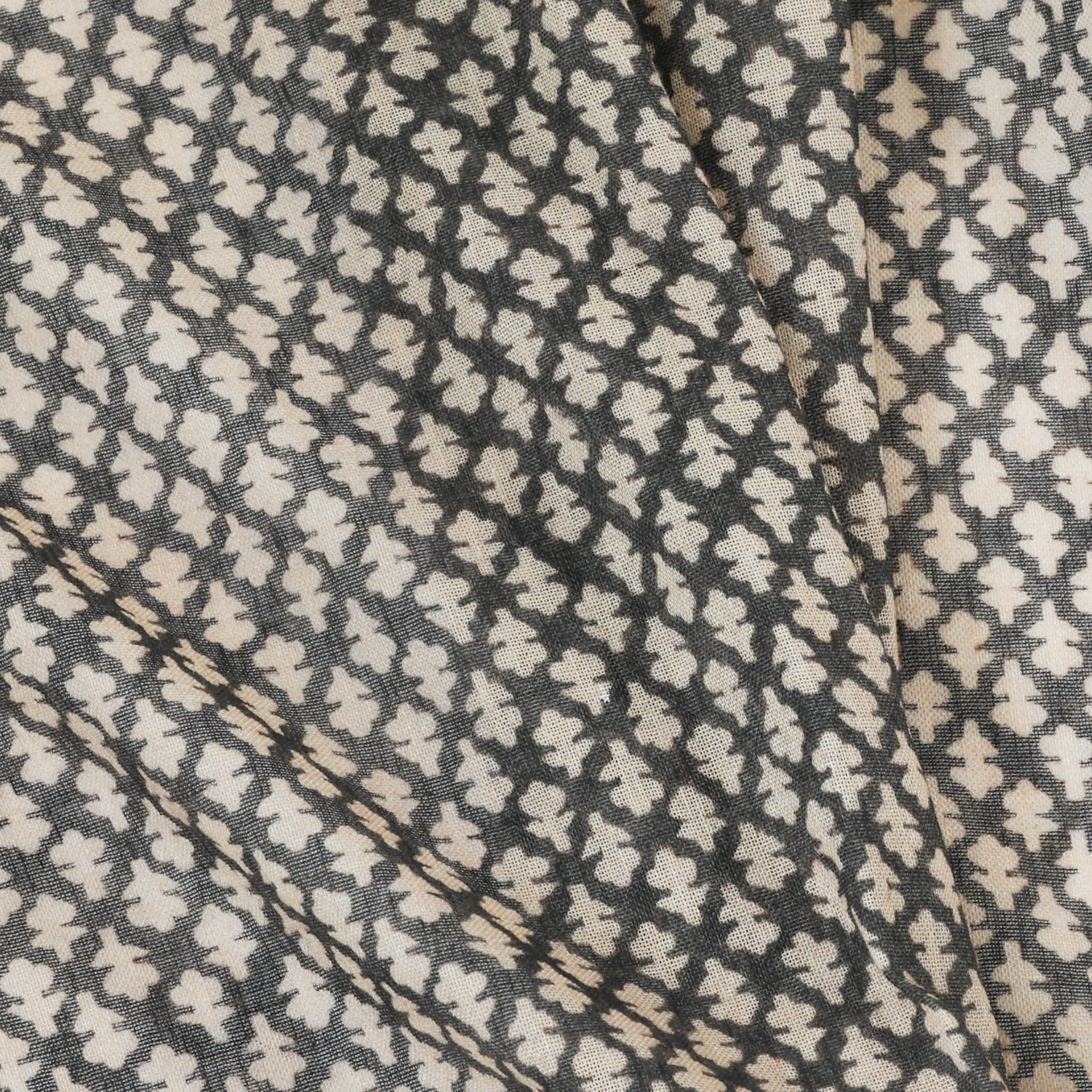 Quinn Charcoal custom fabric featuring a soft geometric floral pattern in charcoal and cream tones for made-to-order designs