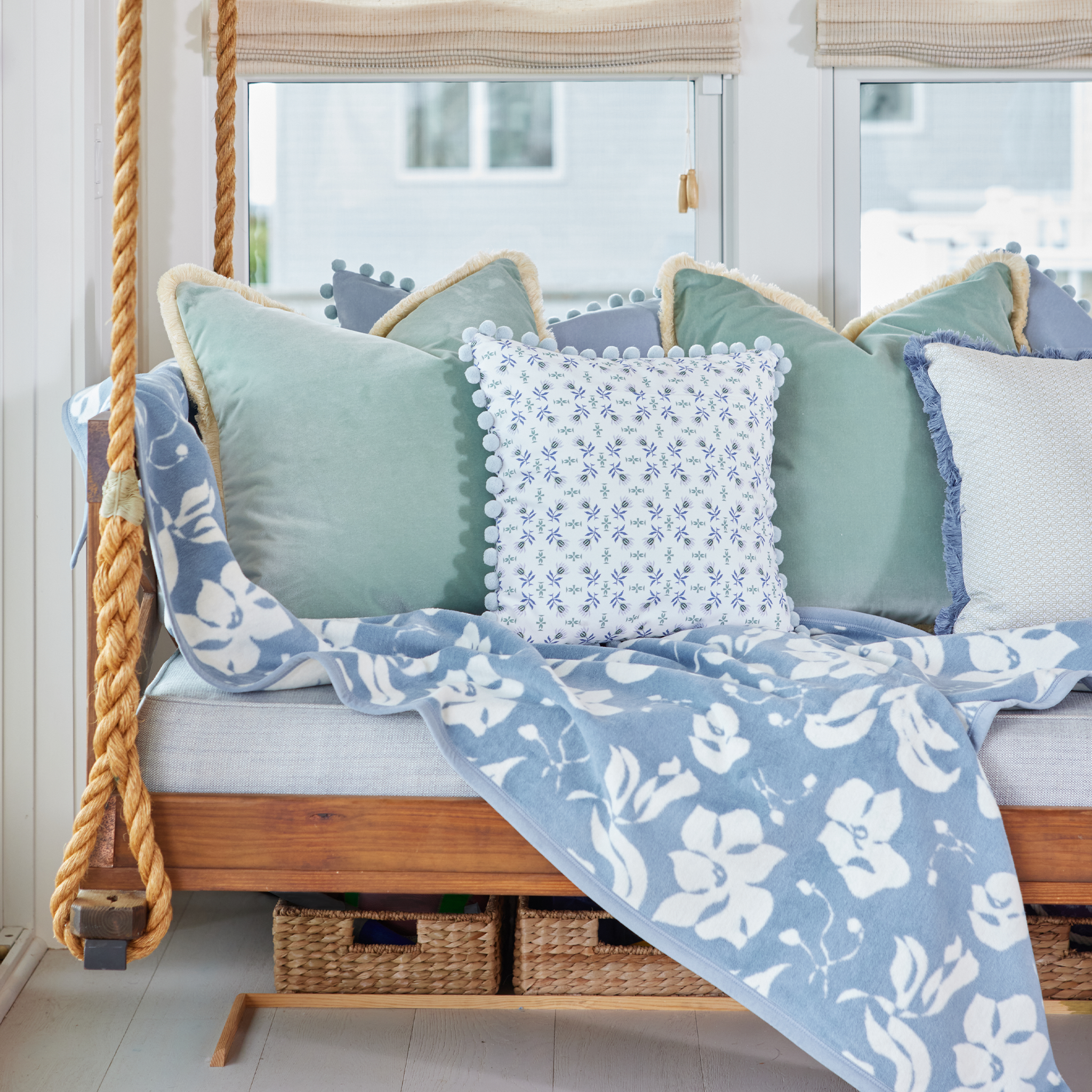 Loomi Moss made-to-order cushions and throw in soft blue and green tones, crafted in the USA with short lead times