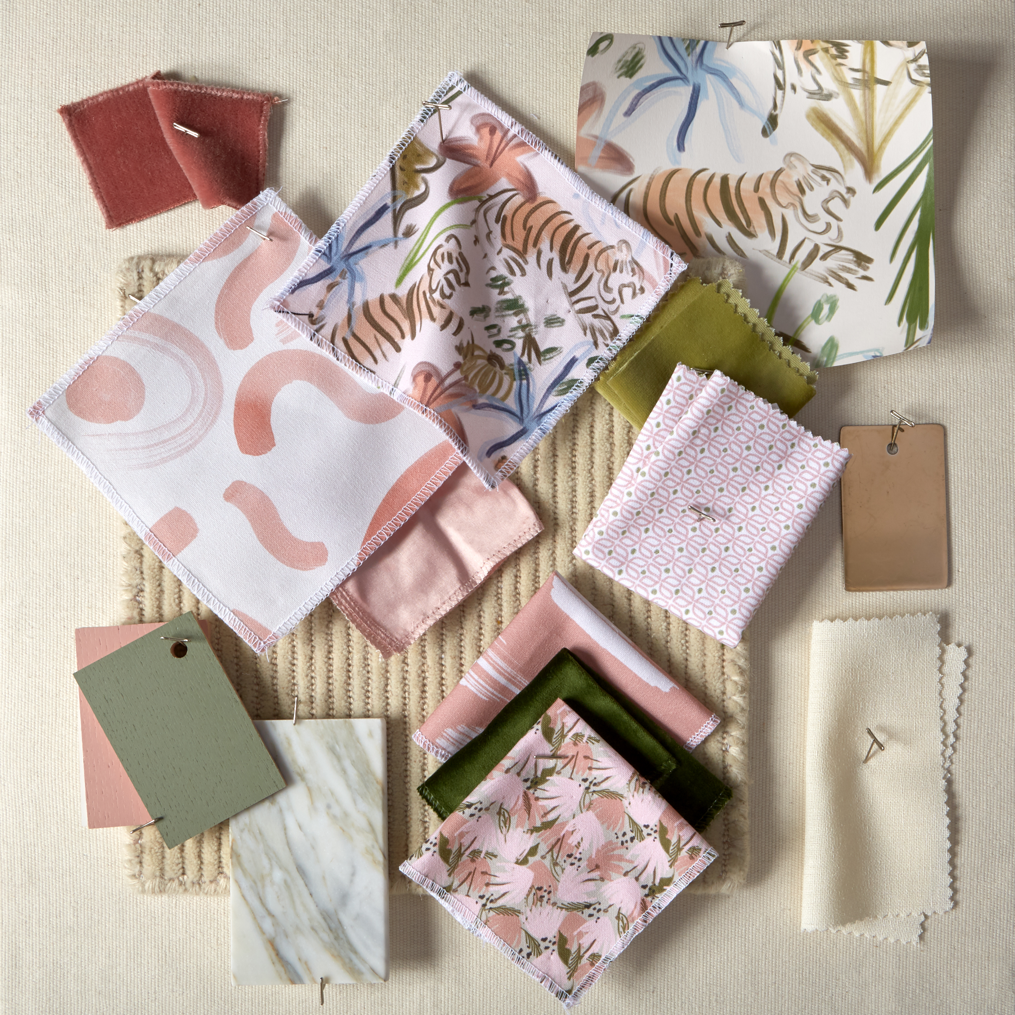 Frida Pink fabric swatches with botanical and tiger designs alongside green and neutral color samples, made-to-order in the USA.